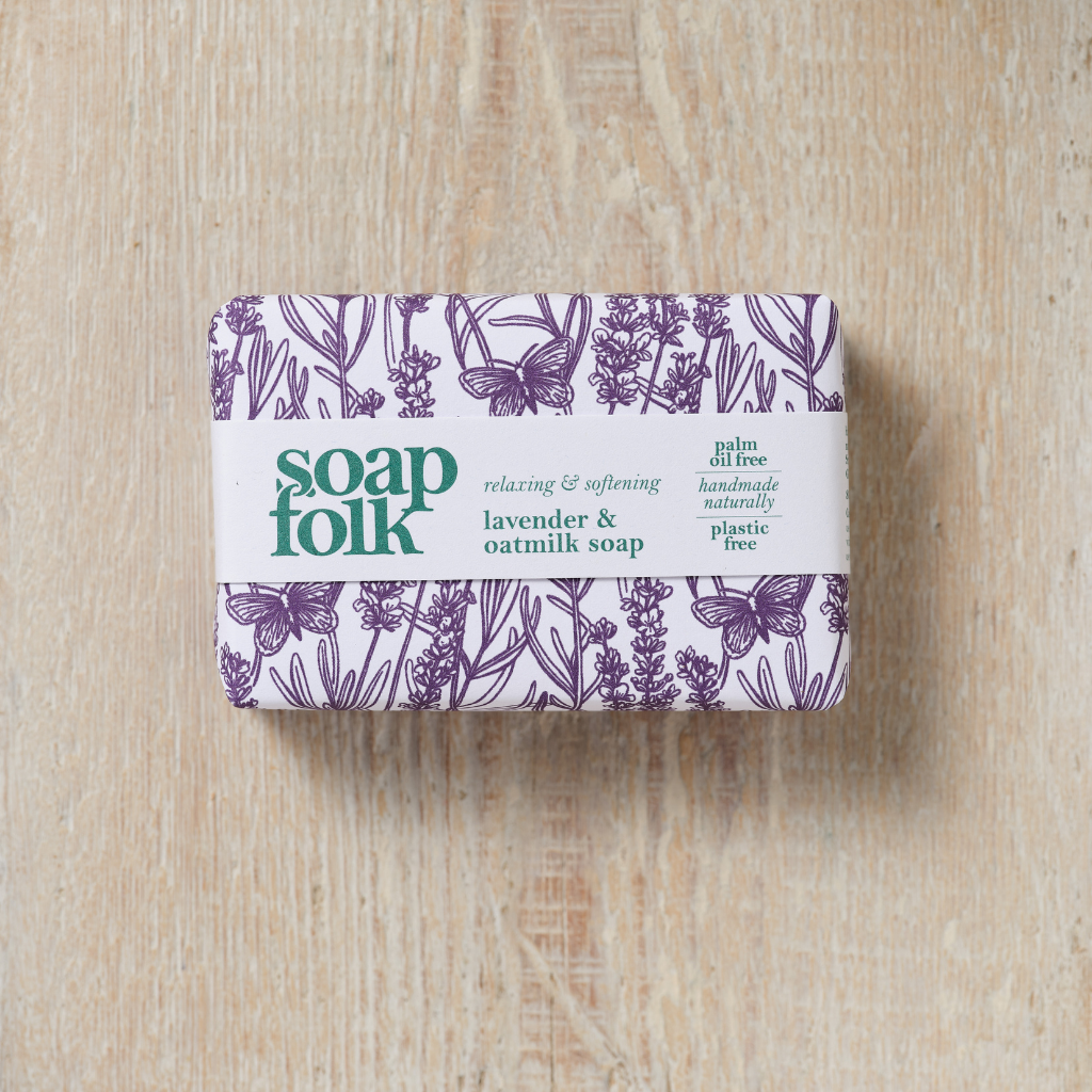 Bar of Lavender and Oatmilk soap with 'Soap Folk' branding on a wooden surface
